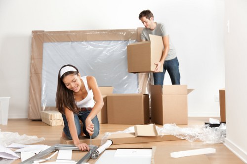 Loading boxes and furniture into a local moving van