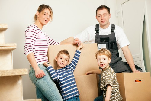 Business moving team handling office furniture and equipment