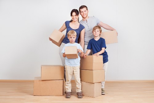 Fragile household items carefully wrapped for local relocation in Norwood Green