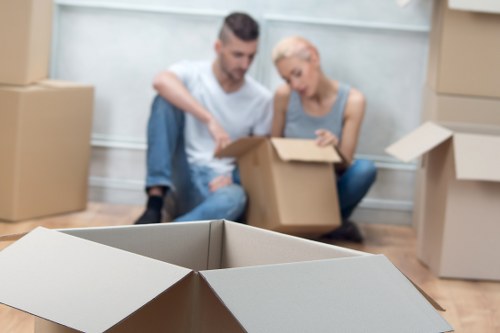 Commercial movers transporting office furniture in Norwood Green