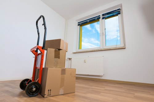 Moving team carrying furniture from a local Norwood Green property