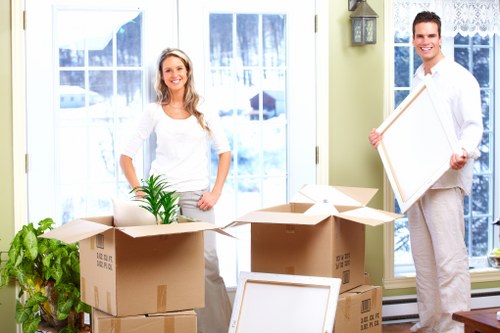 Boxes and furniture being loaded with attention to parking and access