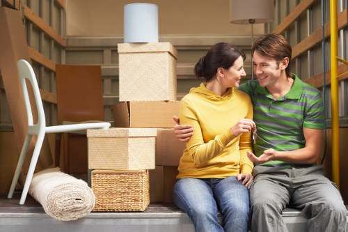 Furniture and boxes being loaded into a moving truck