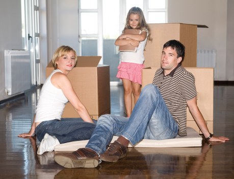 Mover navigating stairs and access challenges in a Norwood Green property